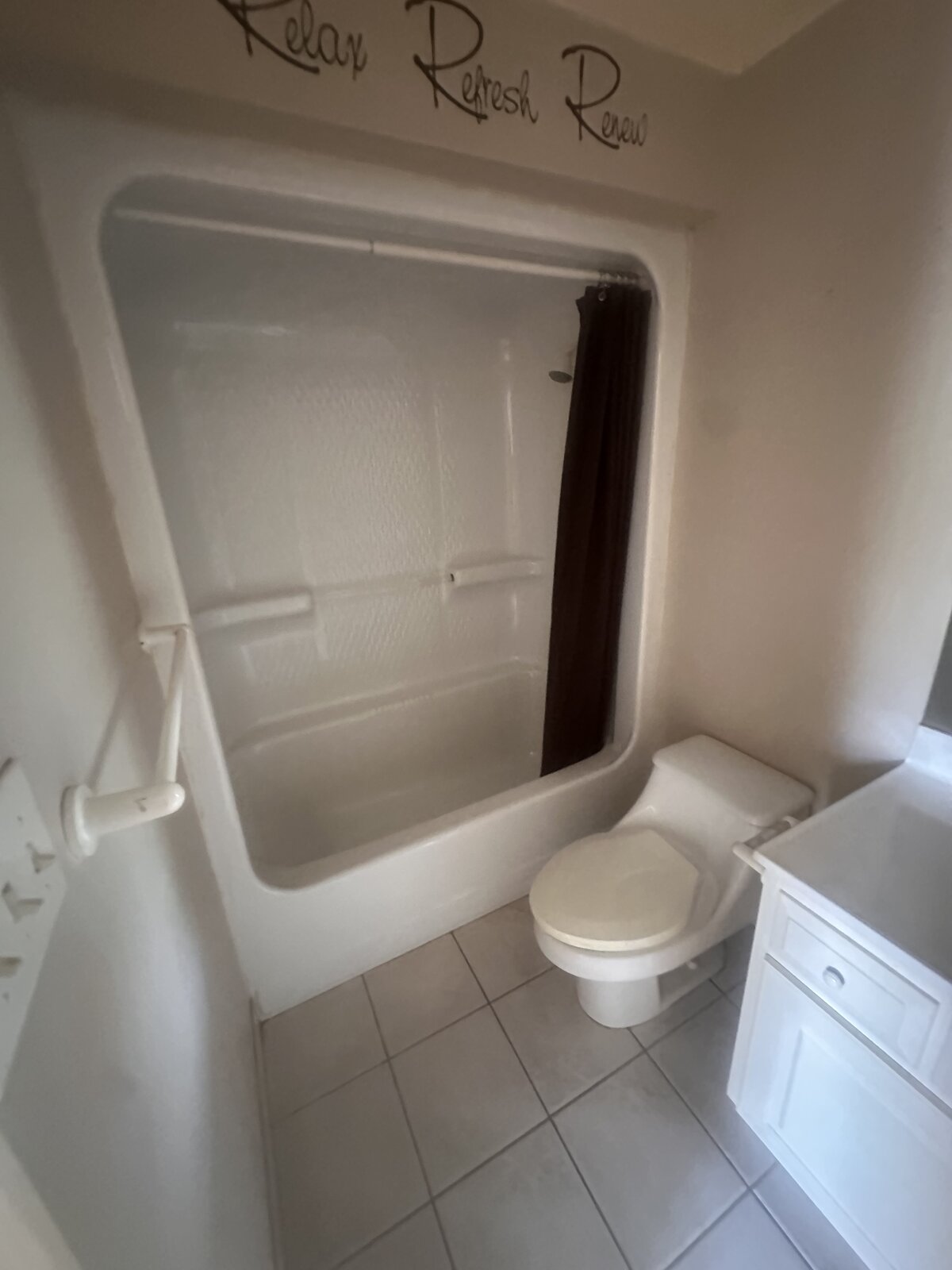 Before: dated bathroom with old vanity and fixtures