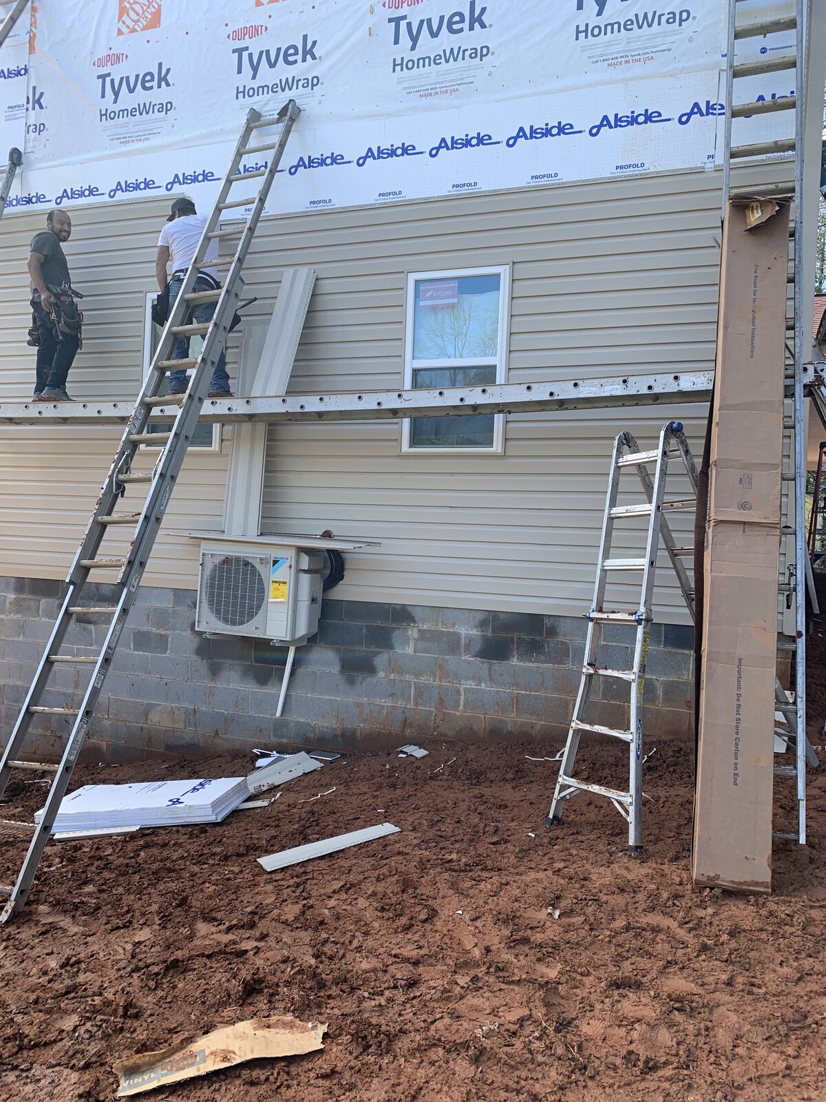 Before: vinyl siding installation over house wrap