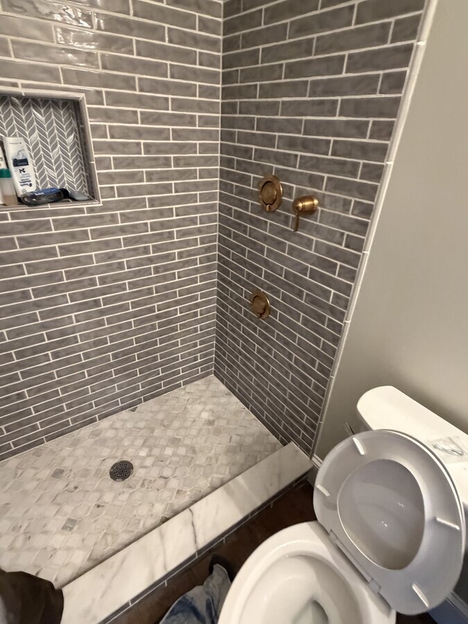 Finished: gold rainfall head, handheld shower and fixtures installed