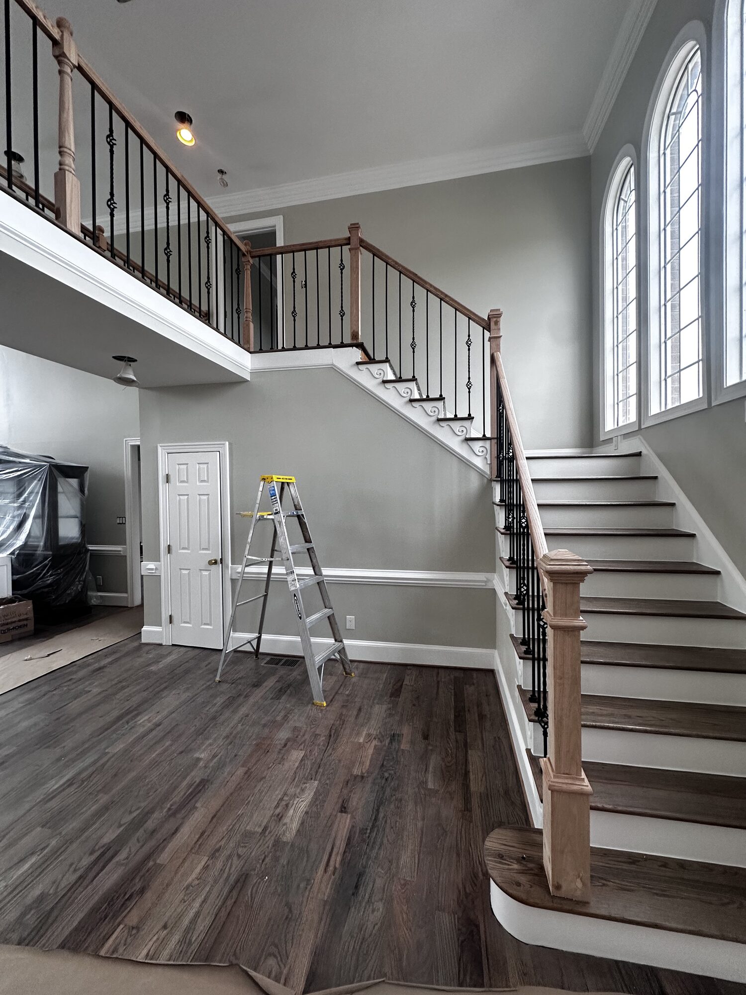 Before: upper bridge walkway with old carpet and white spindle railings